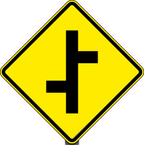 Placa A-11a: Junções sucessivas contrárias 1ª à esquerda